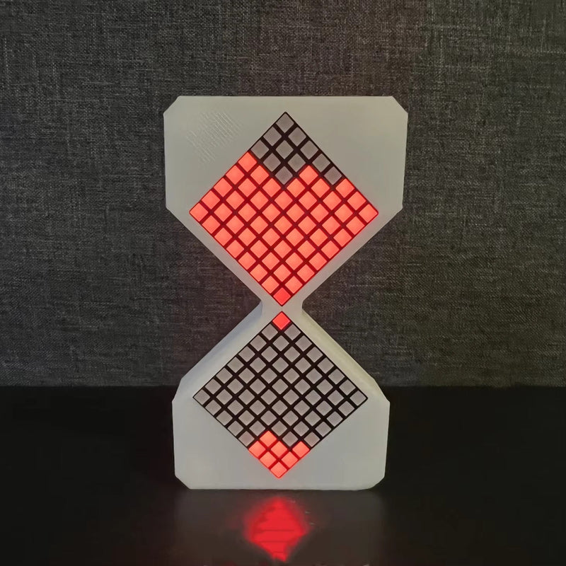3D-printed electronic hourglass with glowing red LED pixel sand