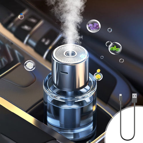 Car aroma diffuser releasing a cool mist in a car cup holder