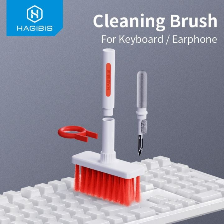 White keyboard and earphone cleaning brush set on a keyboard