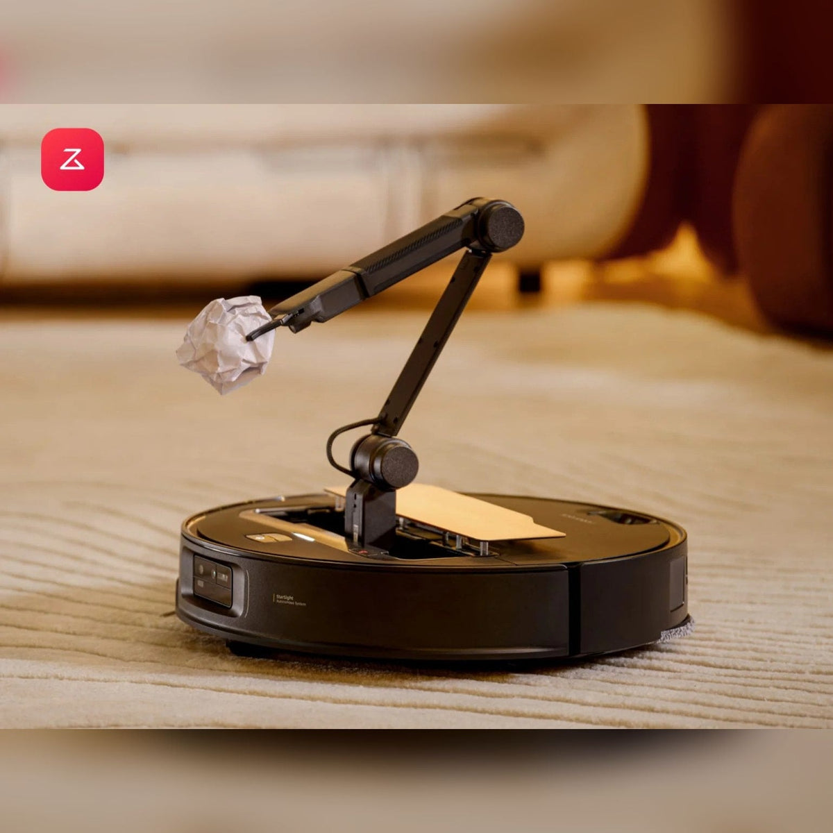 Roborock Saros Z70 robot vacuum picking up crumpled paper with its OmniGrip arm